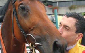 Douglas Whyte gives Akeed Mofeed a kiss after they combined to win the 2013 BMW Hong Kong Derby at Sha Tin. Photos: Kenneth Chan