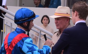 Trainer John Moore (second right) talking with Joao Moreira. Photos: Kenneth Chan