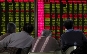 A file picture of investors monitoring stock prices at a brokerage in Beijing. Photo: Reuters