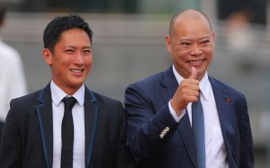 Chris So (right) celebrates another win with his assistant trainer. He is leading the race for the championship after 11 meetings. Photos: Kenneth Chan
