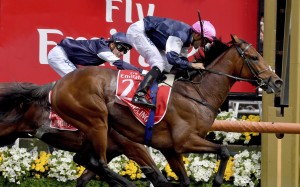 Rekindling and jockey Corey Brown win the Melbourne Cup, watched by Ben Melham on board second-placed Johannes Vermeer at Flemington. Photo: AP