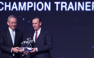 John Size collects his champion trainer trophy in July. Photos: Kenneth Chan
