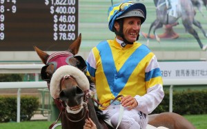Damien Oliver is all smiles after winning with Grand Chancellor at Sha Tin on Sunday. Photos: Kenneth Chan