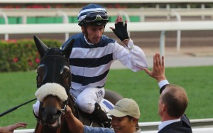 Nash Rawiller gives Richard Gibson a high-five after winning with Harmony Hero. Photos: Kenneth Chan