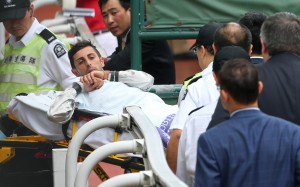 Alberto Sanna goes to hospital after dislocating his shoulder during a race. Photos: Kenneth Chan