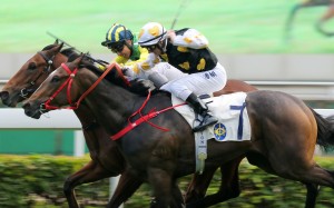 Matthew Poon lifts Speedy Dragon (left) to victory at Sha Tin on Saturday. Photos: Kenneth Chan