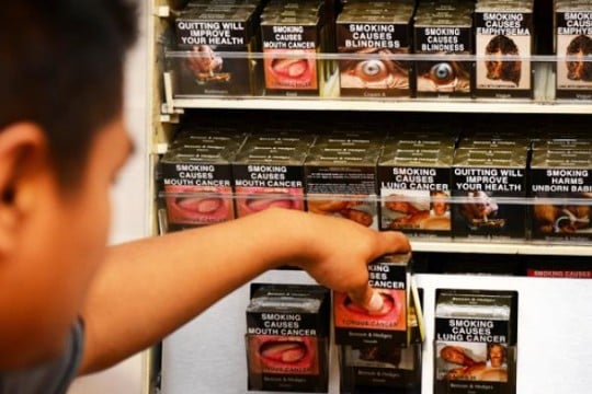 Australia introduces plain packaging for cigarettes