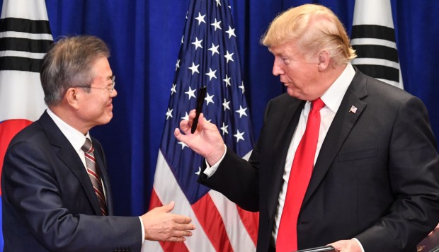 Donald Trump and Moon Jae-in sign renegotiated trade agreement