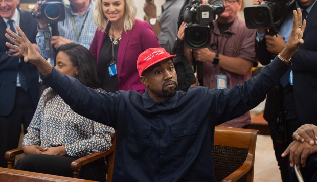 Kanye West at the White House hugs, talks with Trump