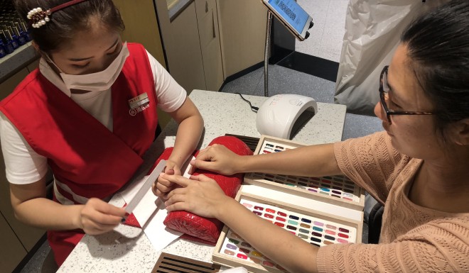 Getting my nails done at a hot pot restaurant...