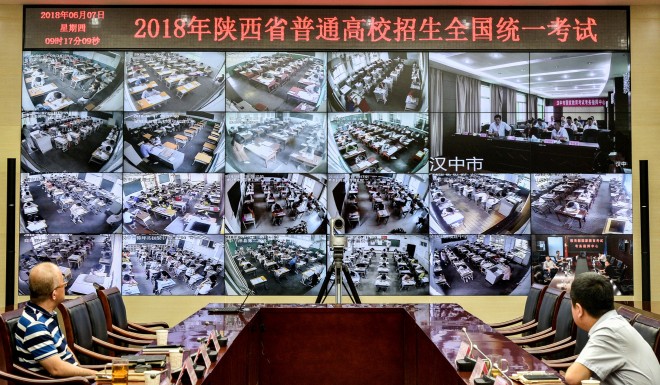 Students are monitored while taking the gaokao exam.