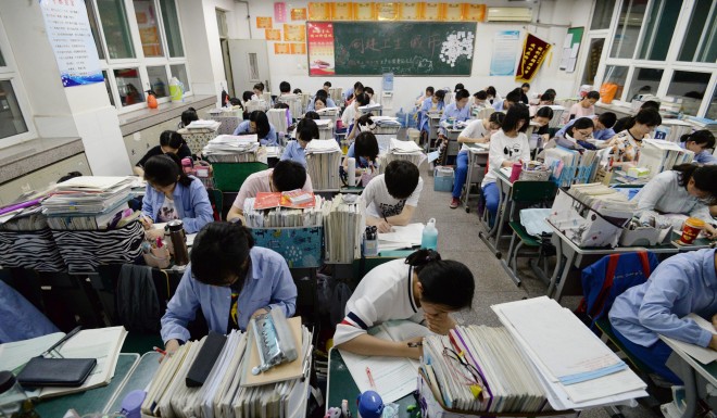 Chinese high school students study late at night for the annual college entrance examinations in Handan, Hebei Province.