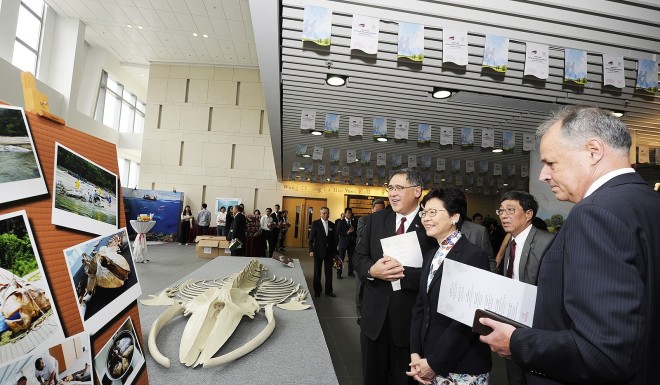 Mrs Carrie Lam (2nd on left) views an exhibition during the naming ceremony for the Jockey Club College of Veterinary Medicine and Life Sciences.