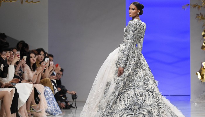 rihanna dress designer Guo Pei, Designer of Rihanna's 2015 Met Gala Gown, Spends Upwards of $1 Million on a Single Fashion Collection