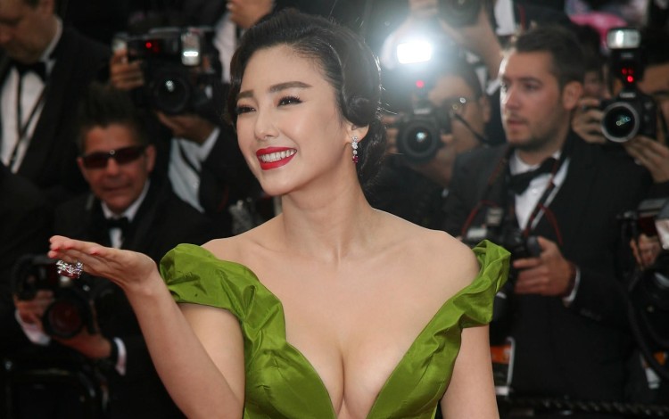Zhang is accused of wounding her husband with a fruit knife after trivial argument turned physical