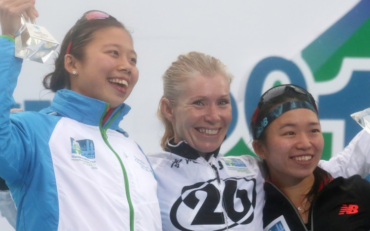 Kate Rutherford (centre) won the women's 10km Challenge at the 2016 Hong Kong Marathon – she is a triathlon coach who wants to create a pathway for more women to follow her. Photo: Nora Tam
