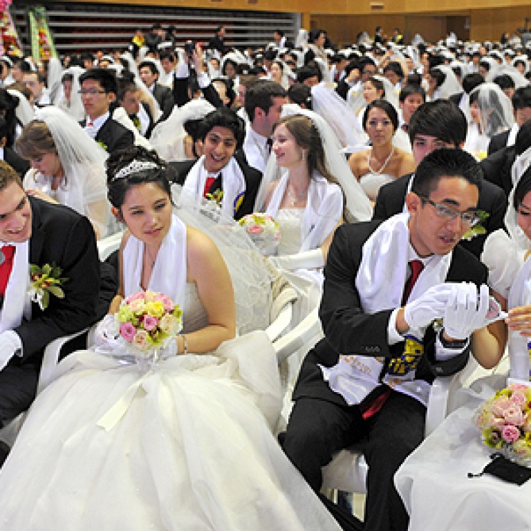 Thousands of Moonies marry in first mass  wedding  after 