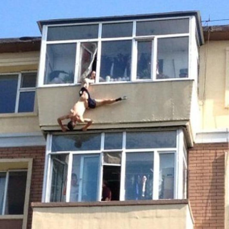 Wife catches husband as he jumps from window | South China Morning Post