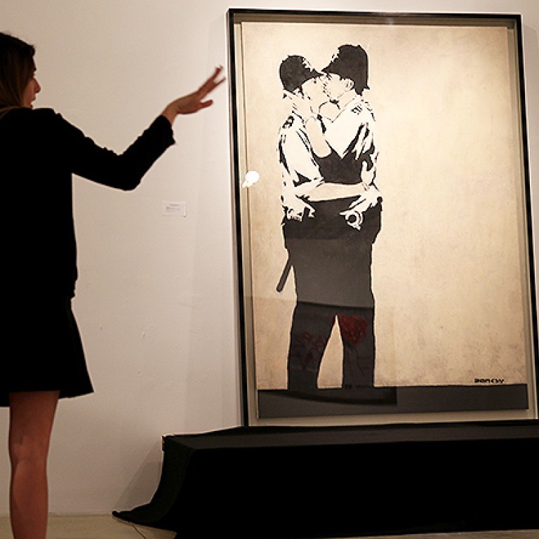 Banksy ‘kissing Coppers Mural Auctioned For Us575000 South China Morning Post