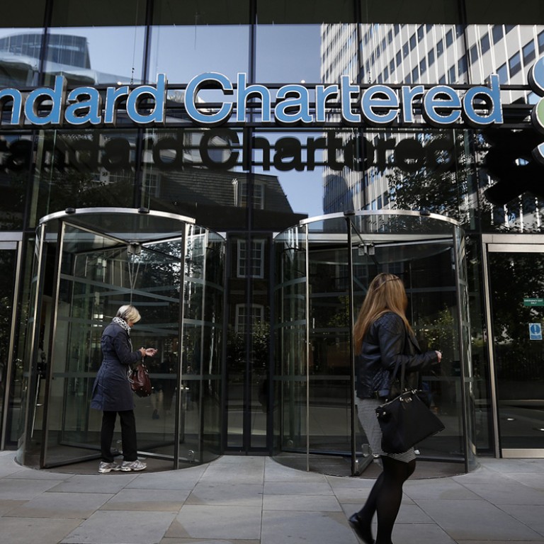Standard Chartered hit with first S&P downgrade in 20 years South
