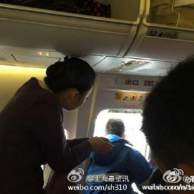 Chinese Passenger Opens Emergency Exit To Get Some Fresh