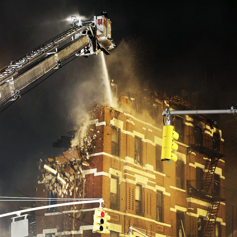 Massive blaze as three New York apartment blocks collapse in gas