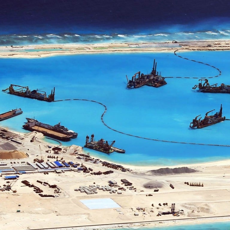 China says land reclamation projects in disputed South China Sea