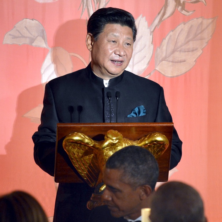 Chinese President Xi Jinping speaks as his wife Madame Peng Liyuan and US President Barack Obama listen during a state dinner at the White House in Washington on Friday. Photo: Reuters