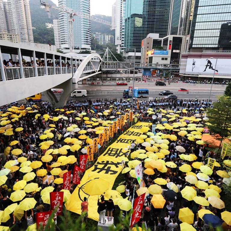 Yellow ribbons, umbrellas return as Hong Kong marks first anniversary