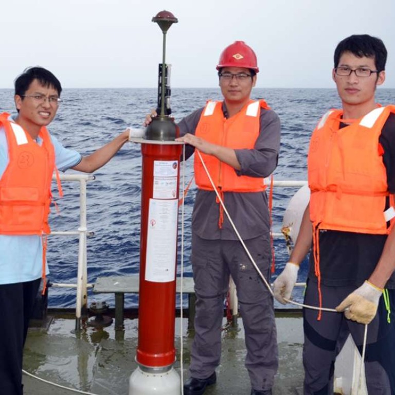 Members of China’s Argo project deploy a floating sensor in the South China Sea. Photo: SCMP Pictures