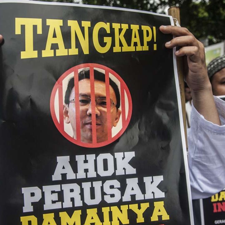 Muslims demand police prosecute the Jakarta governor Basuki Tjahaja Purnama for alleged blasphemy. Photo: AFP