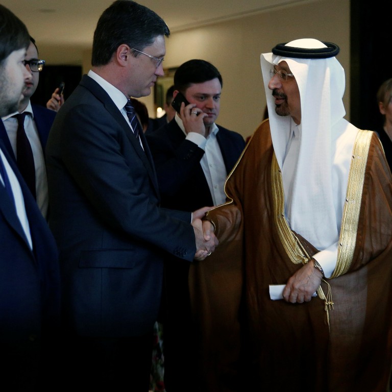 Saudi Arabia's Energy Minister Khalid al-Falih and Russia's Energy Minister Alexander Novak shake hands after a joint briefing in Beijing, China, as an OPEC meeting next week is expected to extend production cuts into 2018. Photo: Reuters
