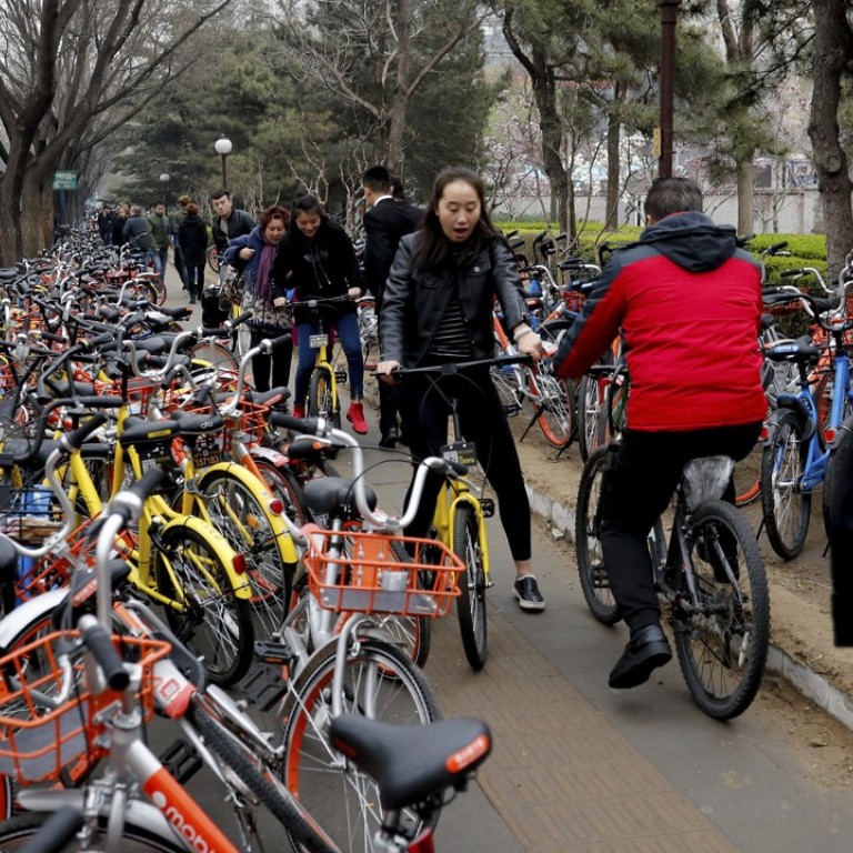 riding bicycle on sidewalk