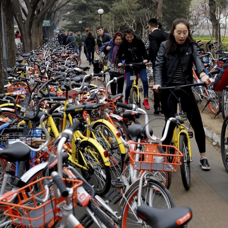 riding bicycle on sidewalk