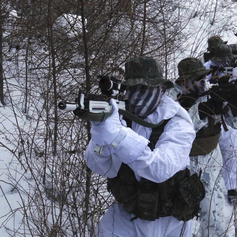 South Korean and US Marines from III-Marine Expeditionary Force from Okinawa, Japan, patrol through the snow during their joint military winter exercise in Pyeongchang, South Korea, in December. The US is actively preparing for a possible war, top US brass have confirmed. Photo: AP