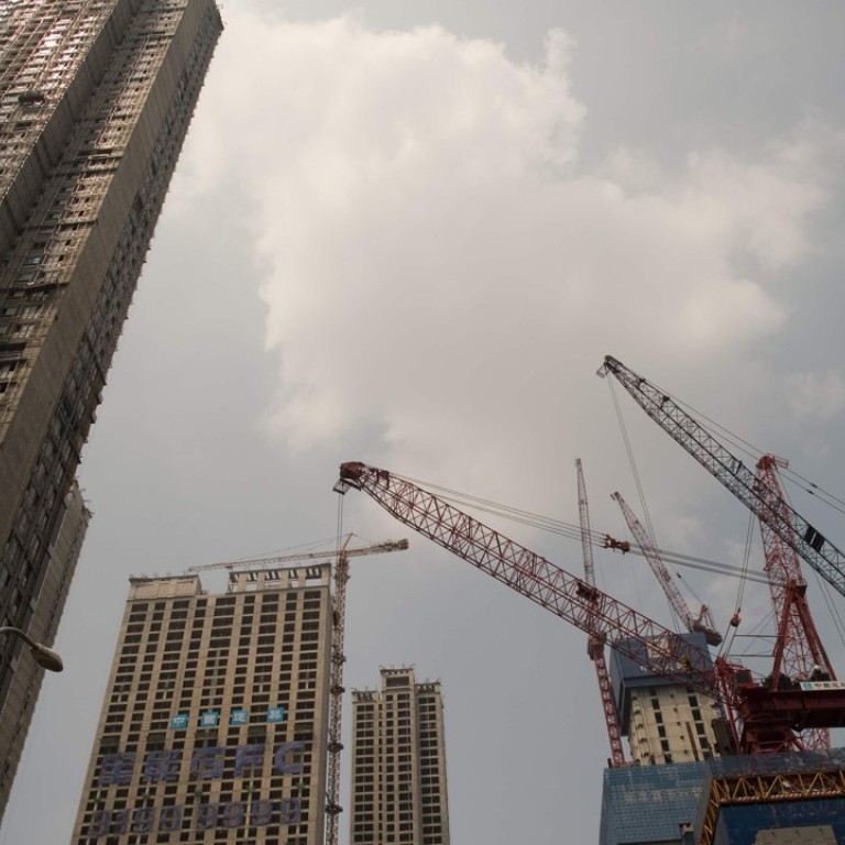 Evergrande issues positive profit alert, saying 2017 net income should