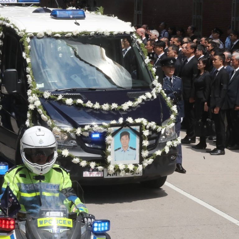 Top Hong Kong officials pay respects at funeral of police officer