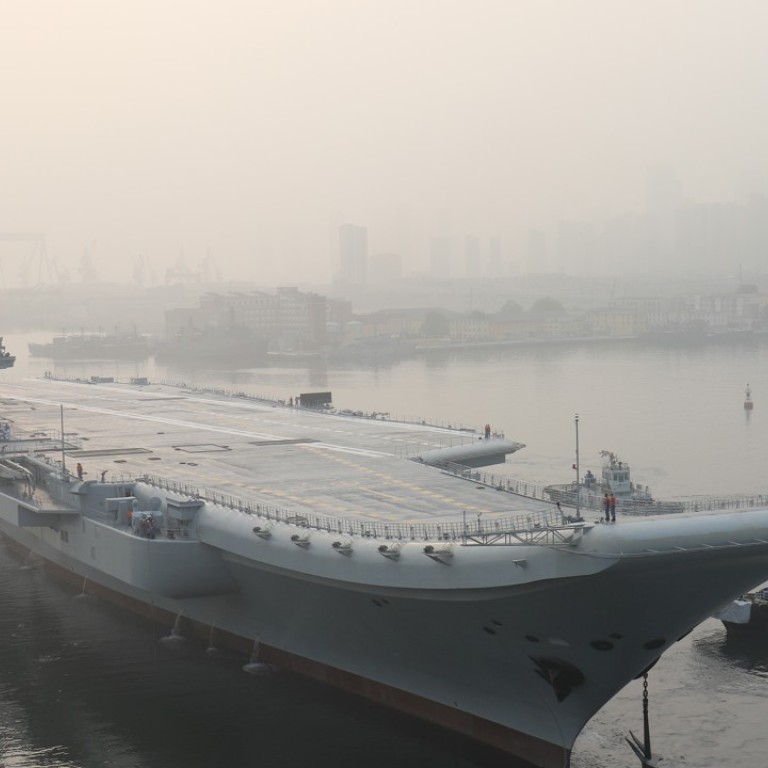 China’s new aircraft carrier leaves Dalian for its first sea trial on Sunday. Photo: Xinhua via AP