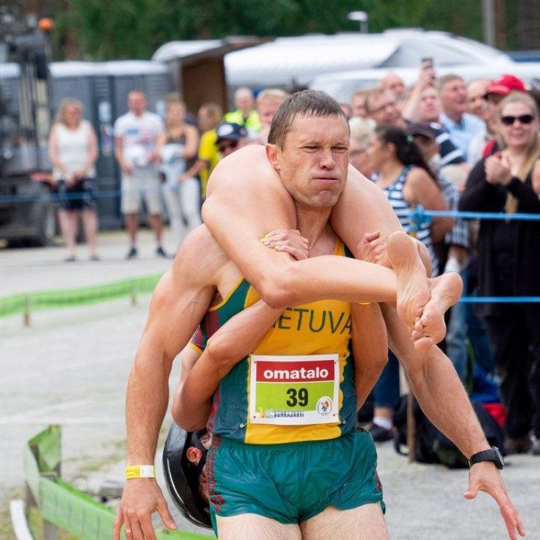 Wife Carrying Is A Thing In Finland This Man And Woman Are World