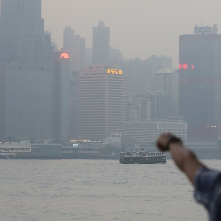 Fidelity International, established in 1969, handles investments for clients in Asia-Pacific, Europe, Middle East and South America. Sightseers at Victoria Harbour in Tsim Sha Tsui. Photo: Sam Tsang