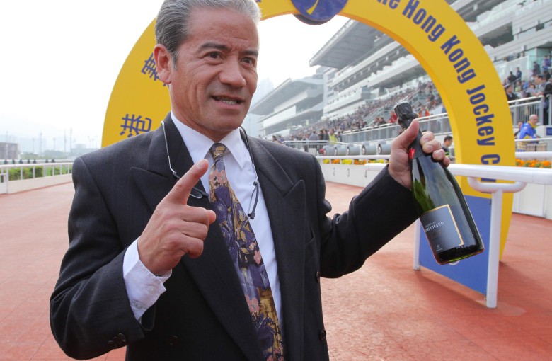 Tony Cruz shows off his bottle of champagne as he celebrates his 1,000th win as a trainer. Photos: Kenneth Chan