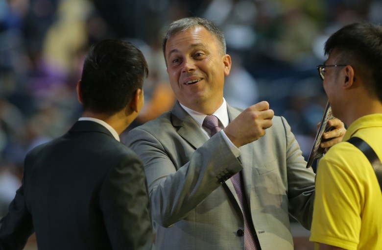 Caspar Fownes celebrates his treble with his team. Photos: Kenneth Chan