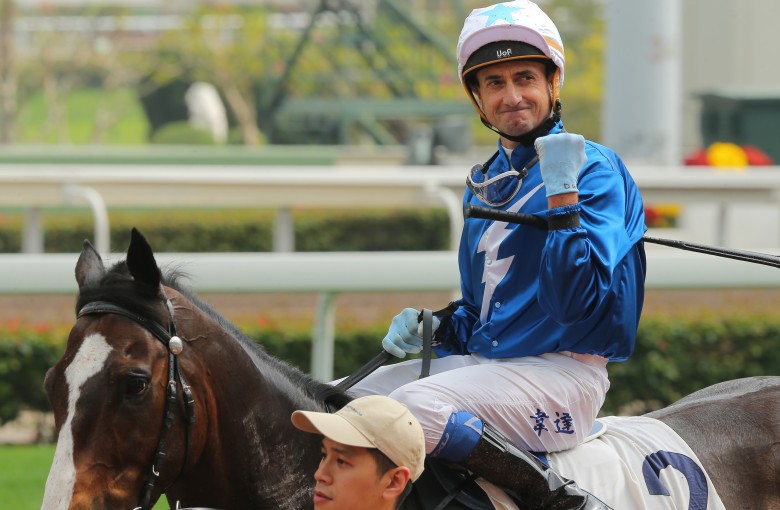 Douglas Whyte celebrates his win aboard Iron Boy on Saturday. Photos: Kenneth Chan