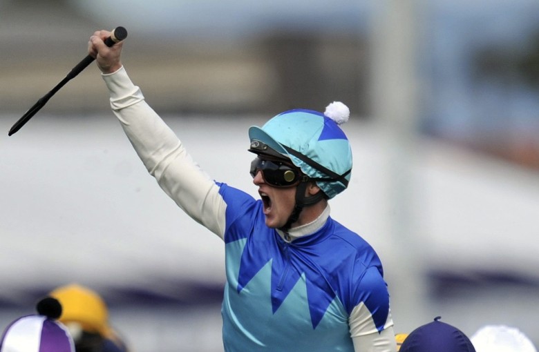 Zac Purton celebrates winning the 2014 Caulfield Cup on Japanese horse Admire Rakti. Photos: EPA