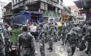The Chinese Army helps Macau residents with the recovery effort after Typhoon Hato hit the city. Photo: Edward Wong