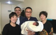 Liu Baojun (centre), who runs a surrogacy institute, flanked by the grandmothers of the baby. Photo: Sina Liu Baojun (centre), who runs a surrogacy institute, flanked by the grandmothers of the baby. Photo: Sina