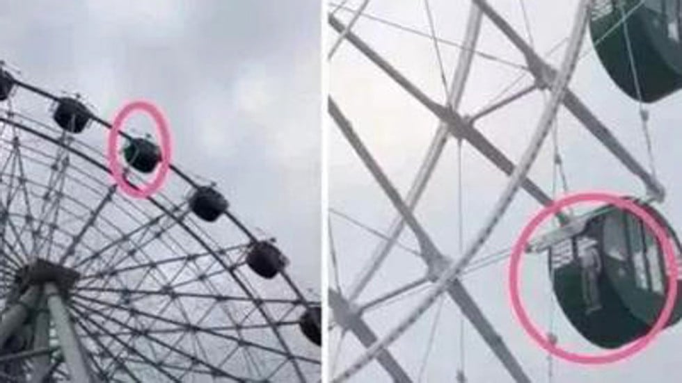 boy dangles dangerously from ferris wheel in chinese amusement park