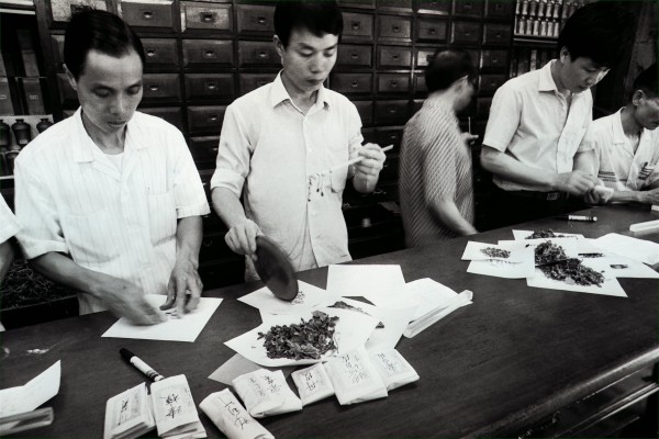 Staff at Eu Yan Sang’s Chinese medicine shop in Central dispensing Chinese herbs in the 1980s. The company now has 248 retail outlets and 34 clinics in Asia and further afield. Photo: SCMP