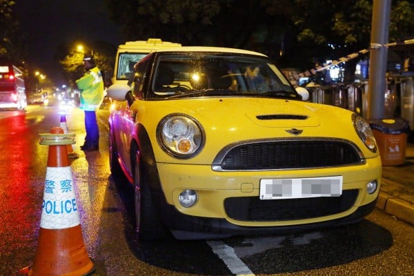 Wong Siew Fing and her daughter Lily Khaw Li Ling were found unresponsive inside this yellow Mini Cooper. Photo: Edmond So