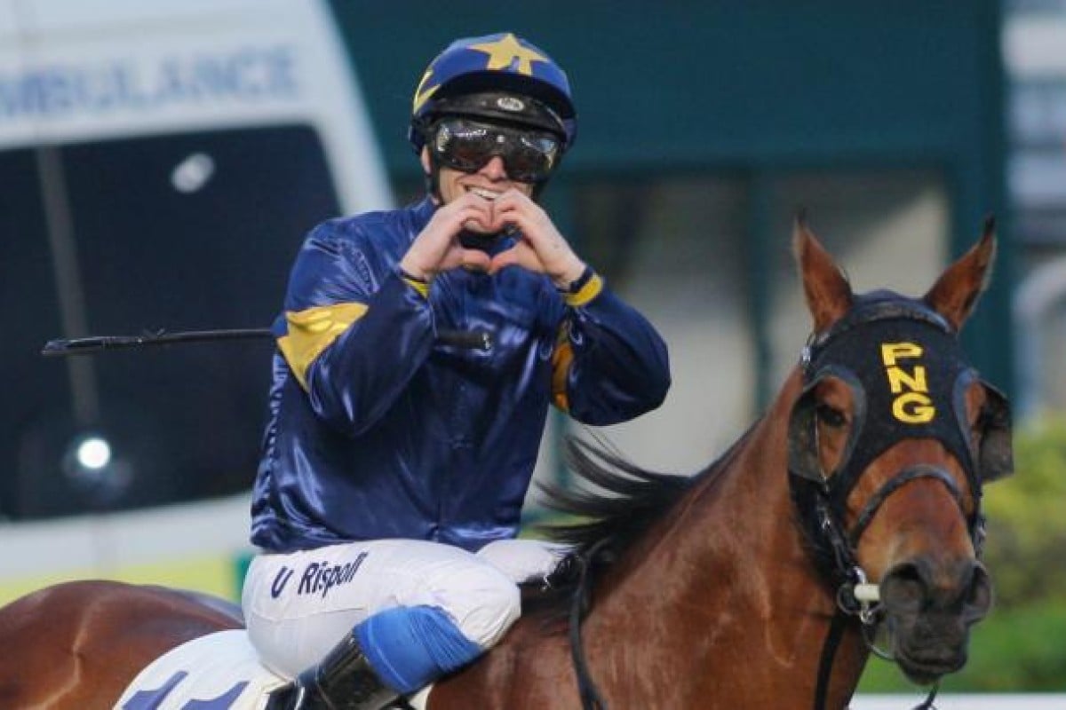 Umberto Rispoli shows his trademark sign on Taknam. Photo: Kenneth Chan